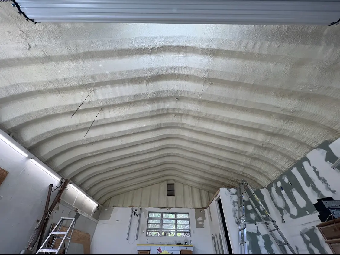 Spray polyurethane foam applied to the underside of a metal roof deck in Gulf Gate